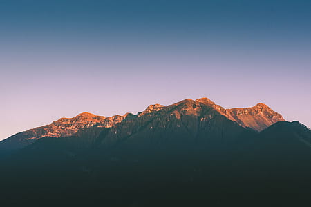 brown mountains under blue skies thumbnail
