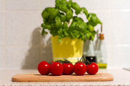 red tomatoes on chopping board thumbnail