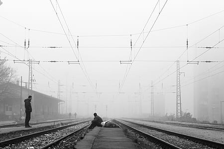 people near train tracks thumbnail