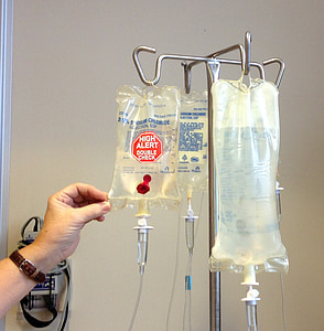 three IV bags on stainless steel stand thumbnail