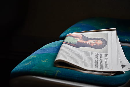 Newspaper on padded chair thumbnail