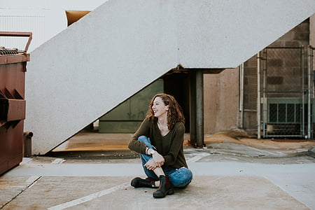 woman squatting on floor thumbnail