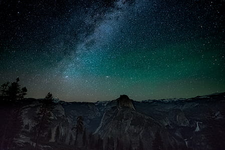 rock formation under starry night thumbnail