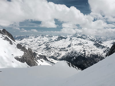 mountain with snow under white sky thumbnail