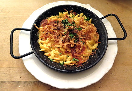 cooked pasta dish on round black sauce pan thumbnail