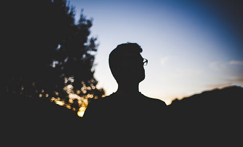 silhouette photo of man wearing glasses thumbnail