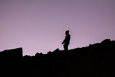 silhouette of person on mountain thumbnail