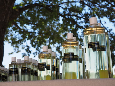 photography of clear glass fragrance bottle lot thumbnail