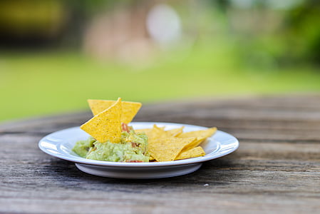 selective focus photography of chip on white ceramic plate thumbnail