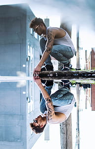 photo of man wearing white tank top thumbnail