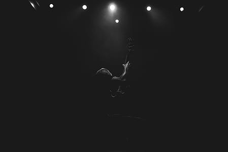 grayscale of guitarist holding guitar thumbnail