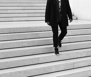 person walking on concrete stairs thumbnail