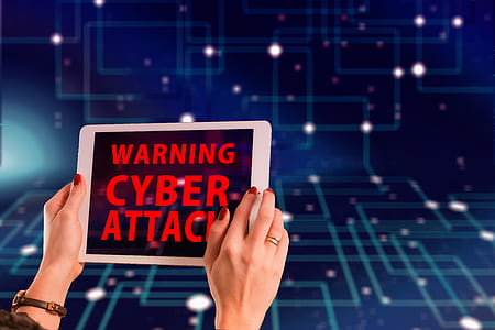 silver iPad displaying warning cyber attack thumbnail