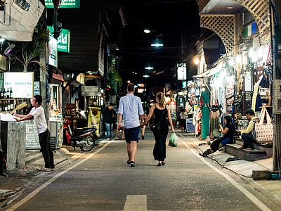 man and woman walking on the street thumbnail