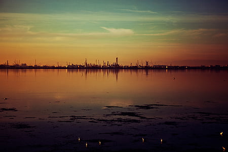 calm body of water during golden hour thumbnail