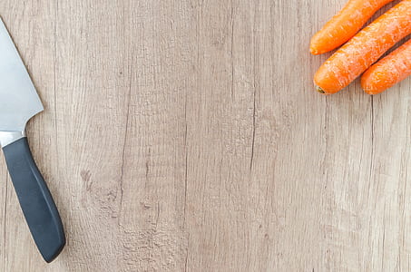 black handled knife near carrots thumbnail