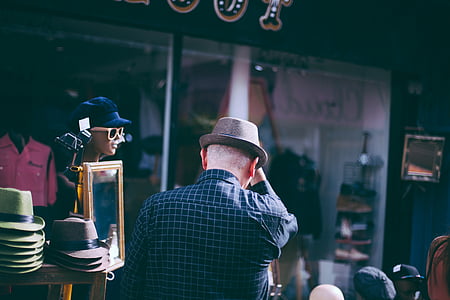 man holding his hat thumbnail