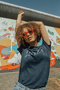 woman raising her arms outdoors thumbnail