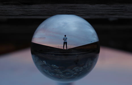 person standing looking at clouds thumbnail