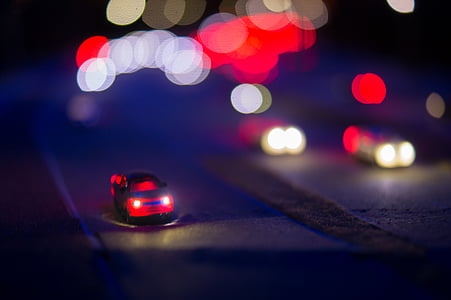 boke photography of cars on road thumbnail