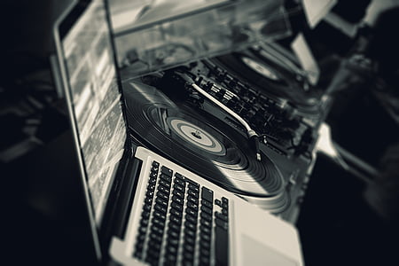 grayscale photography of MacBook and turntable thumbnail