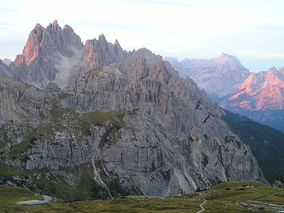 mountain near green grassland thumbnail