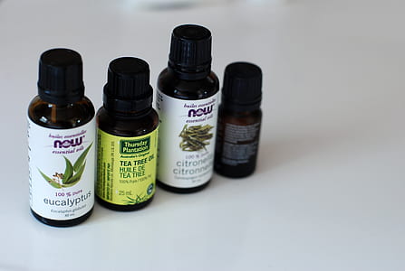 four black glass bottles with caps thumbnail