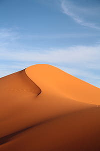 dessert under blue sky with white clouds thumbnail