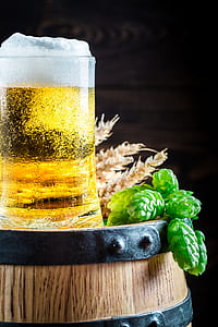 beer in mug on wooden barrel thumbnail