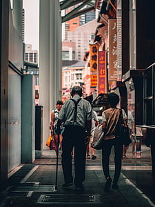 people walking on sidewalk thumbnail