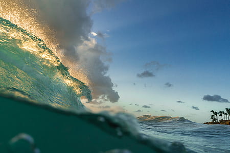 close-up photo of surging wave under gray sky thumbnail