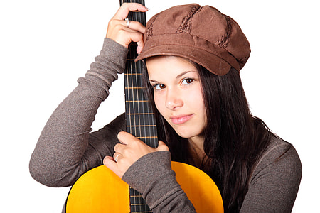 woman wearing gray long-sleeved shirt and brown cap holding brown guitar thumbnail