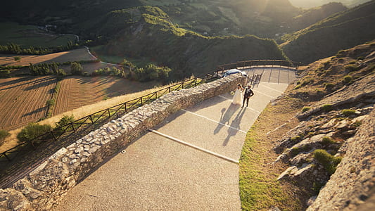 man climbing on stair beside mountain thumbnail