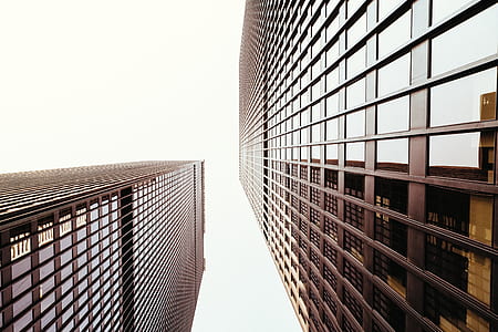 low-angle sepia photo of two buildings thumbnail