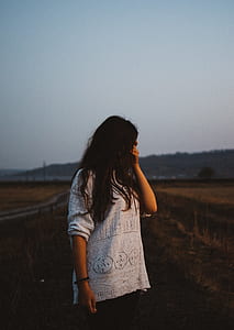woman standing in the middle of the field thumbnail