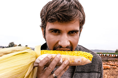 man eating corn thumbnail