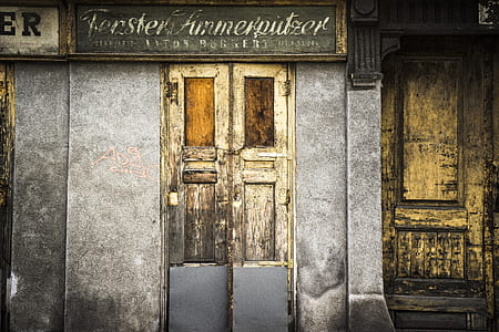 gray concrete building with 2-door photo thumbnail