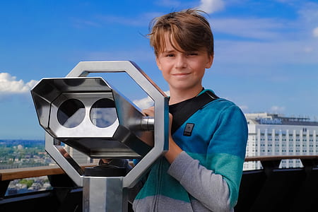boy standing in front of tower viewer thumbnail