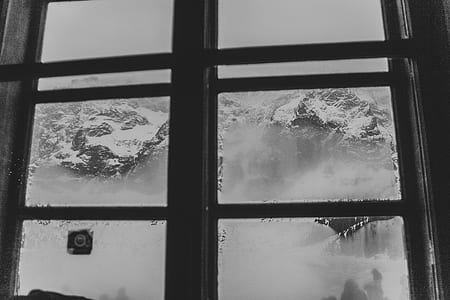 snow capped mountain outside window thumbnail