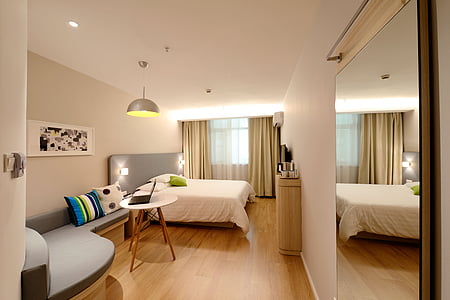 white bed sheet inside a bed room thumbnail
