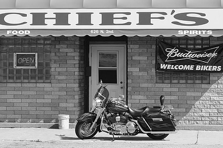 black touring motorcycle park in front of Chief's restaurant thumbnail