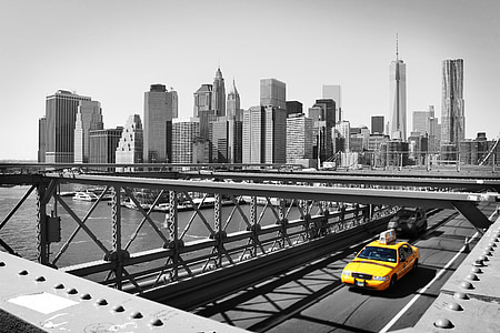 selective color photo of yellow car on bridge thumbnail