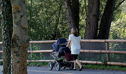 woman pushing black stroller thumbnail