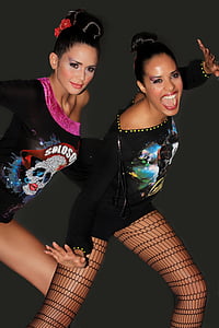 two woman wearing long-sleeved shirts thumbnail