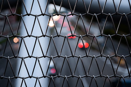 selective focus photography of black wire fence thumbnail