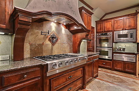 stainless steel gas stove on brown wooden kitchen console thumbnail