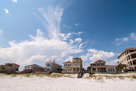 six assorted-color buildings near seashore thumbnail