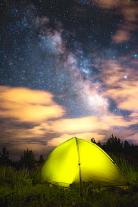 yellow dome tent on green grass field thumbnail