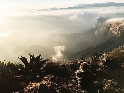 man sitting on mountain thumbnail