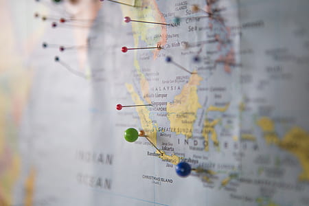 assorted-colored pin on country map thumbnail